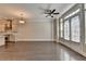 Living room features hardwood floors, French doors to the outside, stainless steel kitchen appliances and neutral paint at 595 Broadview Ne Pl, Atlanta, GA 30324