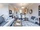 Bright living room open to the kitchen and dining area, perfect for modern living at 595 Broadview Ne Pl, Atlanta, GA 30324