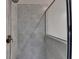 Close up of a walk in shower with a glass door and gray tile surround at 595 Broadview Ne Pl, Atlanta, GA 30324