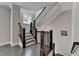 Elegant staircase features dark wood railing and trim paired with freshly painted neutral walls and hardwood flooring at 595 Broadview Ne Pl, Atlanta, GA 30324