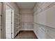 Walk-in closet with custom shelving and hardwood floors at 595 Broadview Ne Pl, Atlanta, GA 30324