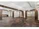 Finished basement featuring brick columns, tile flooring, and recessed lighting at 68 Highcrest Dr, Acworth, GA 30101