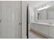 Bright bathroom boasts double sinks, a large mirror, and white cabinets at 68 Highcrest Dr, Acworth, GA 30101