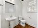 Bathroom with a pedestal sink and white toilet at 68 Highcrest Dr, Acworth, GA 30101