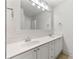 Bathroom featuring double sinks, white cabinets, and a large mirror at 68 Highcrest Dr, Acworth, GA 30101