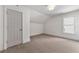 Bedroom with gray door, window with blinds, and neutral carpet at 68 Highcrest Dr, Acworth, GA 30101