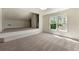 Large carpeted bonus room with built-in platform and a window view at 68 Highcrest Dr, Acworth, GA 30101