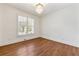 Light and airy bedroom with hardwood floors, plantation shutters, and modern chandelier at 68 Highcrest Dr, Acworth, GA 30101