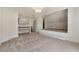 Large carpeted room featuring built-in shelves and a built-in platform at 68 Highcrest Dr, Acworth, GA 30101