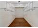 Walk-in closet features hardwood floors and custom shelving at 68 Highcrest Dr, Acworth, GA 30101