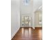 Bright foyer with hardwood floors, high ceilings, and a view of the front yard through the glass door at 68 Highcrest Dr, Acworth, GA 30101