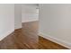 Hallway features hardwood floors and white trim at 68 Highcrest Dr, Acworth, GA 30101