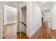 Bright hallway with hardwood floors and multiple doorways leading to other rooms at 68 Highcrest Dr, Acworth, GA 30101