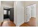 Hallway with hardwood floors, open doorways and access to multiple rooms at 68 Highcrest Dr, Acworth, GA 30101