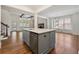 Kitchen island with a sink and modern appliances next to the main living area at 68 Highcrest Dr, Acworth, GA 30101