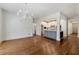 Living room with hardwood floors and open concept design flows to the kitchen at 68 Highcrest Dr, Acworth, GA 30101