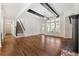 Bright living room features hardwood floors, staircase and access to outdoor spaces at 68 Highcrest Dr, Acworth, GA 30101