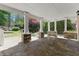 Covered patio with stone floors and columns overlooking the lush backyard at 68 Highcrest Dr, Acworth, GA 30101