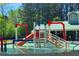 Community splash pad with colorful pipes, slide, and easy access stairs for endless fun at 68 Highcrest Dr, Acworth, GA 30101