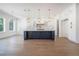 Spacious kitchen features a large island, ample cabinets, and a pendant lighting at 876 Bramlett Shoals Rd, Lawrenceville, GA 30045