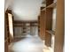 Spacious walk-in closet featuring unfinished custom cabinets and shelving at 876 Bramlett Shoals Rd, Lawrenceville, GA 30045