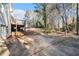 Spacious backyard featuring a deck, patio area, and lush greenery at 1837 Miramonte Way, Lawrenceville, GA 30045
