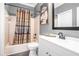 Cozy bathroom features a tub with shower and a classic vanity with lighting at 1837 Miramonte Way, Lawrenceville, GA 30045