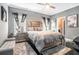 Bedroom with a queen bed, ceiling fan, and a soft gray color palette at 1837 Miramonte Way, Lawrenceville, GA 30045