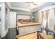 Bedroom with hardwood floors, natural light, and a decorative headboard at 1837 Miramonte Way, Lawrenceville, GA 30045