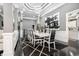 Elegant dining area featuring a modern chandelier, stylish decor, and seating for ten, perfect for entertaining at 1837 Miramonte Way, Lawrenceville, GA 30045