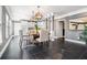 Elegant dining room features modern lighting fixtures and a stylish table setting, perfect for entertaining guests at 1837 Miramonte Way, Lawrenceville, GA 30045