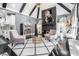 Open-concept living area with stone fireplace, vaulted ceilings, statement lighting, and comfortable seating at 1837 Miramonte Way, Lawrenceville, GA 30045