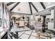 Open-concept living and kitchen area with vaulted ceilings, statement lighting, comfortable seating, and dining area at 1837 Miramonte Way, Lawrenceville, GA 30045