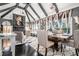 Open-concept living and dining space with vaulted ceilings, statement lighting, comfortable seating, and decorative fireplace at 1837 Miramonte Way, Lawrenceville, GA 30045