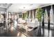 Open-concept living area with black floors, high ceilings, and stylish decor creating a sophisticated and inviting space at 1837 Miramonte Way, Lawrenceville, GA 30045