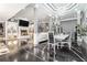 Open-concept living space with fireplace, modern lighting, and dining area create the ideal space for relaxation and entertainment at 1837 Miramonte Way, Lawrenceville, GA 30045