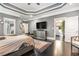 Spacious main bedroom features a tray ceiling, dark wood floors, and a sitting area at 1837 Miramonte Way, Lawrenceville, GA 30045