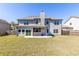 Large backyard features a hot tub on a concrete pad and a fenced perimeter at 3728 In Bloom Way, Auburn, GA 30011