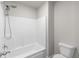 Bathroom featuring a white tub surround and modern shower head at 3728 In Bloom Way, Auburn, GA 30011