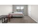 Neutral bedroom with a comfortable bed, window, and plush carpeting at 3728 In Bloom Way, Auburn, GA 30011