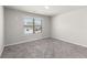 Bedroom featuring neutral carpet, a bright window, and white walls at 3728 In Bloom Way, Auburn, GA 30011
