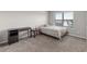 Neutral bedroom with a comfortable bed, desk, and plush carpeting at 3728 In Bloom Way, Auburn, GA 30011