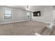 Spacious bonus room features neutral walls and plush carpeting at 3728 In Bloom Way, Auburn, GA 30011