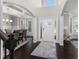 Grand entrance with a high ceiling, decorative columns, and hardwood floors providing a luxurious feel at 3728 In Bloom Way, Auburn, GA 30011