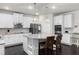 Beautiful kitchen features white cabinets, granite countertops, stainless appliances, and large island at 3728 In Bloom Way, Auburn, GA 30011
