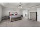 Bright main bedroom featuring plush carpet, ample closet space, and natural light at 3728 In Bloom Way, Auburn, GA 30011