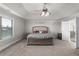 Large main bedroom featuring decorative trey ceiling, plush carpet, and natural light at 3728 In Bloom Way, Auburn, GA 30011