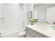 Modern bathroom featuring a white tiled shower-tub combination and a stylish vanity with a plant at 1998 Shalimar Ne Dr, Atlanta, GA 30345