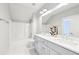 Clean bathroom with a double vanity, a bathtub-shower combination, and white hexagonal tile floors at 1998 Shalimar Ne Dr, Atlanta, GA 30345