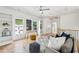 Open living space with hardwood floors, built-in shelves, and modern furniture, bathed in natural light at 1998 Shalimar Ne Dr, Atlanta, GA 30345